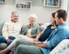 Shot of a young couple and their elderly parent spending some time together at home